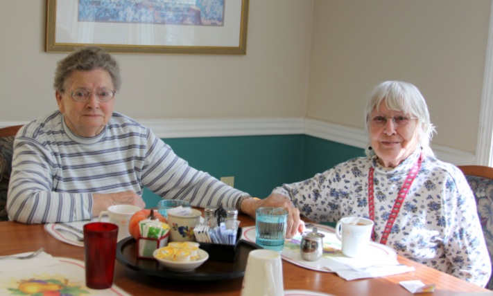 Two older women having a meal together